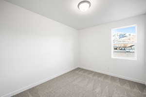 Unfurnished room with carpet flooring