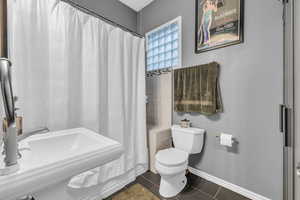 Bathroom featuring sink and toilet