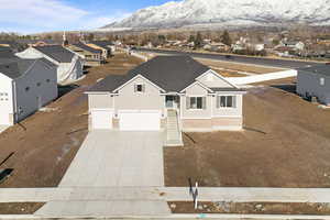 Exterior space with a garage and a mountain view