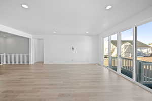 Unfurnished room featuring a textured ceiling and light hardwood / wood-style floors