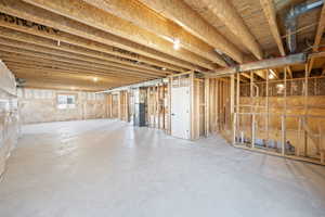 Basement featuring heating unit