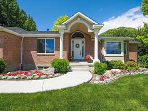 Ranch-style home featuring a front yard