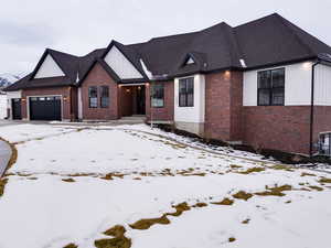 View of front of property featuring a garage