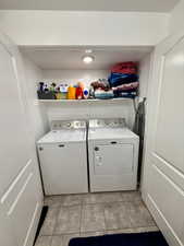 Accessory apartment laundry in the full bathroom w/ closet doors