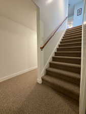 Stairs from the storage rooms & mother-in-law apt to the main floor