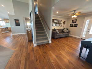 Views of the formal living room, stairs to the top floor and main floor family room/kitchen