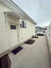 View of both apartments exterior entrance & off street parking