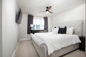 Bedroom featuring light carpet and ceiling fan