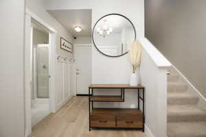 Interior space featuring a chandelier and light hardwood / wood-style floors