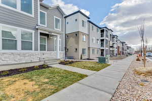 View of property's community featuring a yard