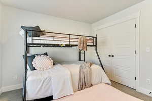 Bedroom with carpet flooring and a closet