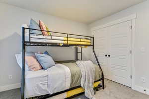 Bedroom with a closet and carpet