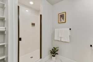 Bathroom featuring a shower with shower door