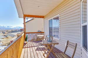 Wooden terrace featuring a mountain view