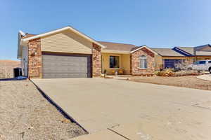 Single story home featuring a garage