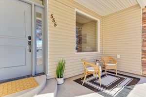 Entrance to property featuring a porch