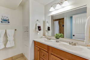 Bathroom featuring vanity and walk in shower