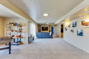 Interior space featuring light colored carpet