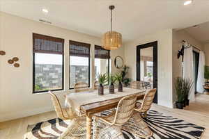 Dining space featuring light hardwood / wood-style flooring