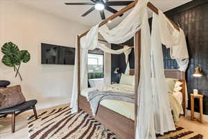 Bedroom with light hardwood / wood-style flooring and ceiling fan