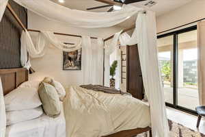 Bedroom featuring access to outside and ceiling fan