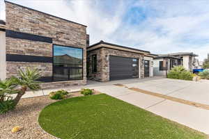 View of front of property featuring a garage