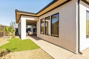 Back of house with a patio area