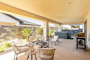 View of patio featuring a hot tub