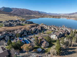 Drone / aerial view featuring a water and mountain view