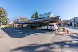 View of vehicle parking with a carport