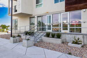 View of exterior entry featuring a patio area