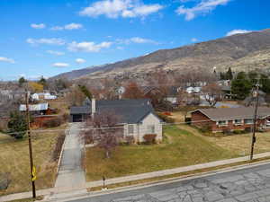 Birds eye view of property with a mountain view