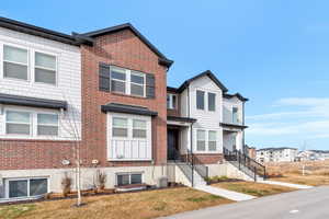 View of front of house with cooling unit