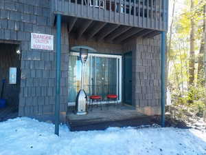 View of snow covered property entrance