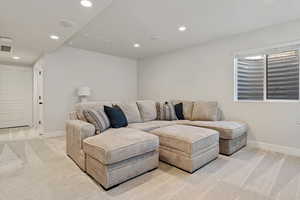 Living room featuring light colored carpet