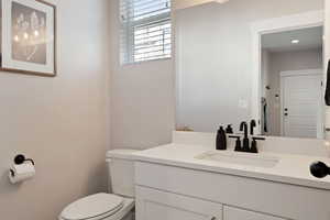 Bathroom featuring vanity and toilet