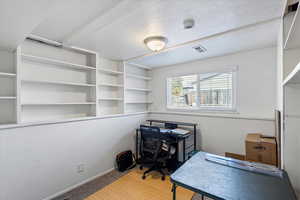 Bedroom 4 featuring new paint and carpet floors and built in shelves