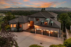 View of front facade featuring a garage and a mountain view