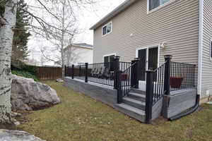 Deck featuring a lawn