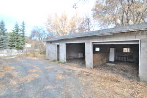 View of two garage stalls and extra storage as well.