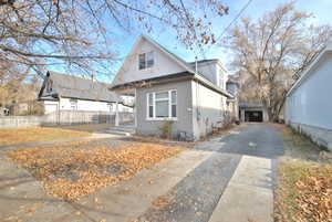 View of front of property featuring a detached garage