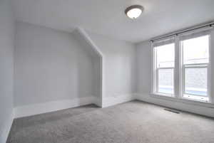 Bedroom room featuring plenty of natural light and carpet flooring