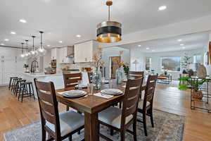 Dining room with sink and light hardwood / wood-style floors