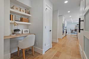 Hallway featuring light hardwood / wood-style flooring