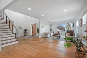 Foyer entrance with light hardwood / wood-style floors