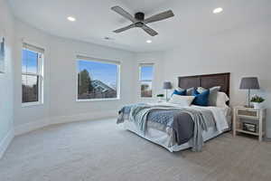 Carpeted bedroom with ceiling fan