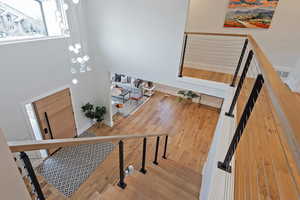 Staircase with hardwood / wood-style flooring