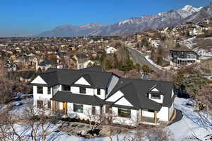 Snowy aerial view with a mountain view