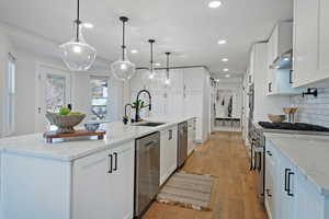 Kitchen with sink and white cabinets