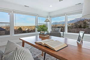 Sunroom with a mountain view and plenty of natural light